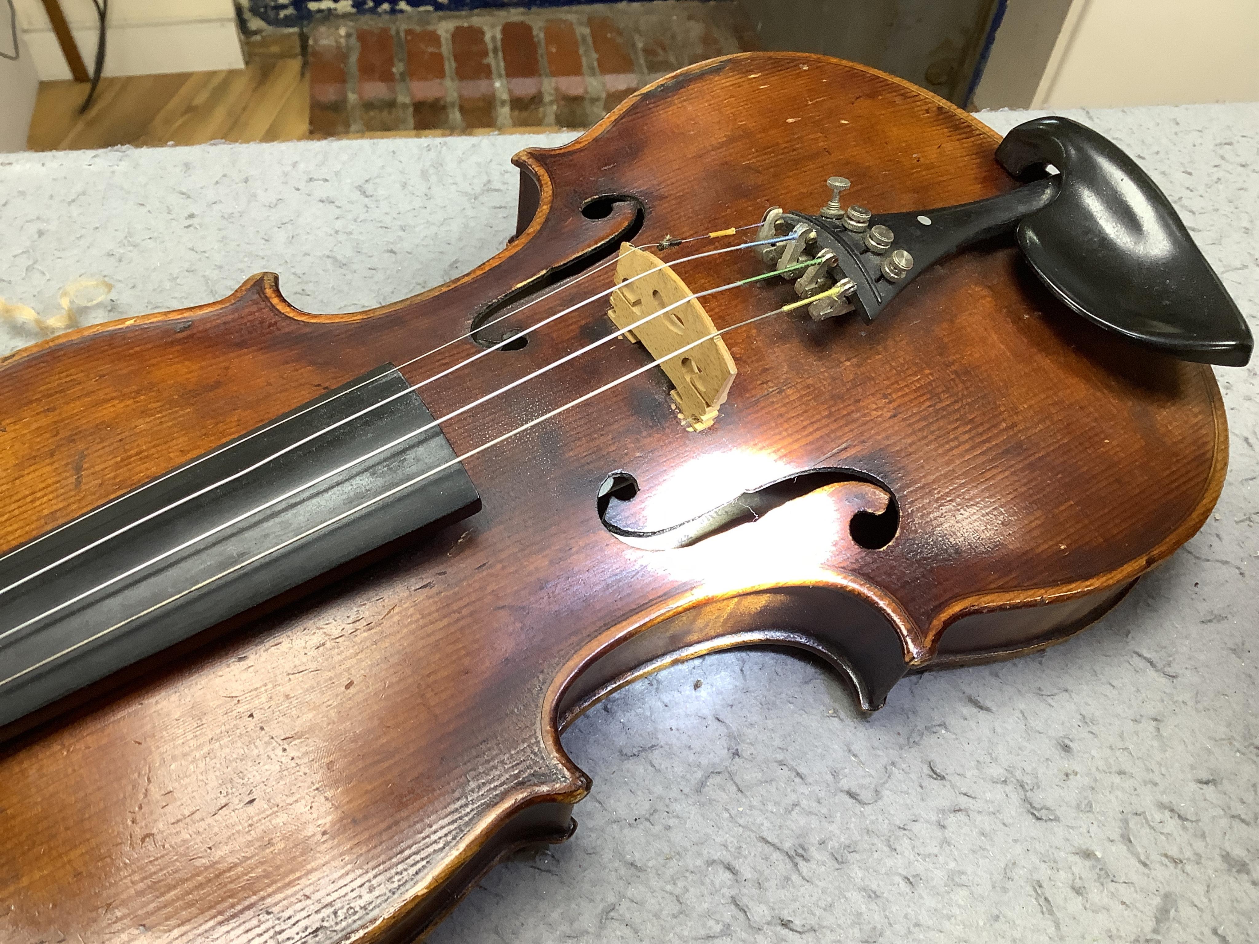 A cased 19th century English violin, with label reading George Craske, Fecit 1842, Edward Crompton, 54, Barton Arcade, Deansgate, Manchester, body length 36cm. Condition - fair to good.